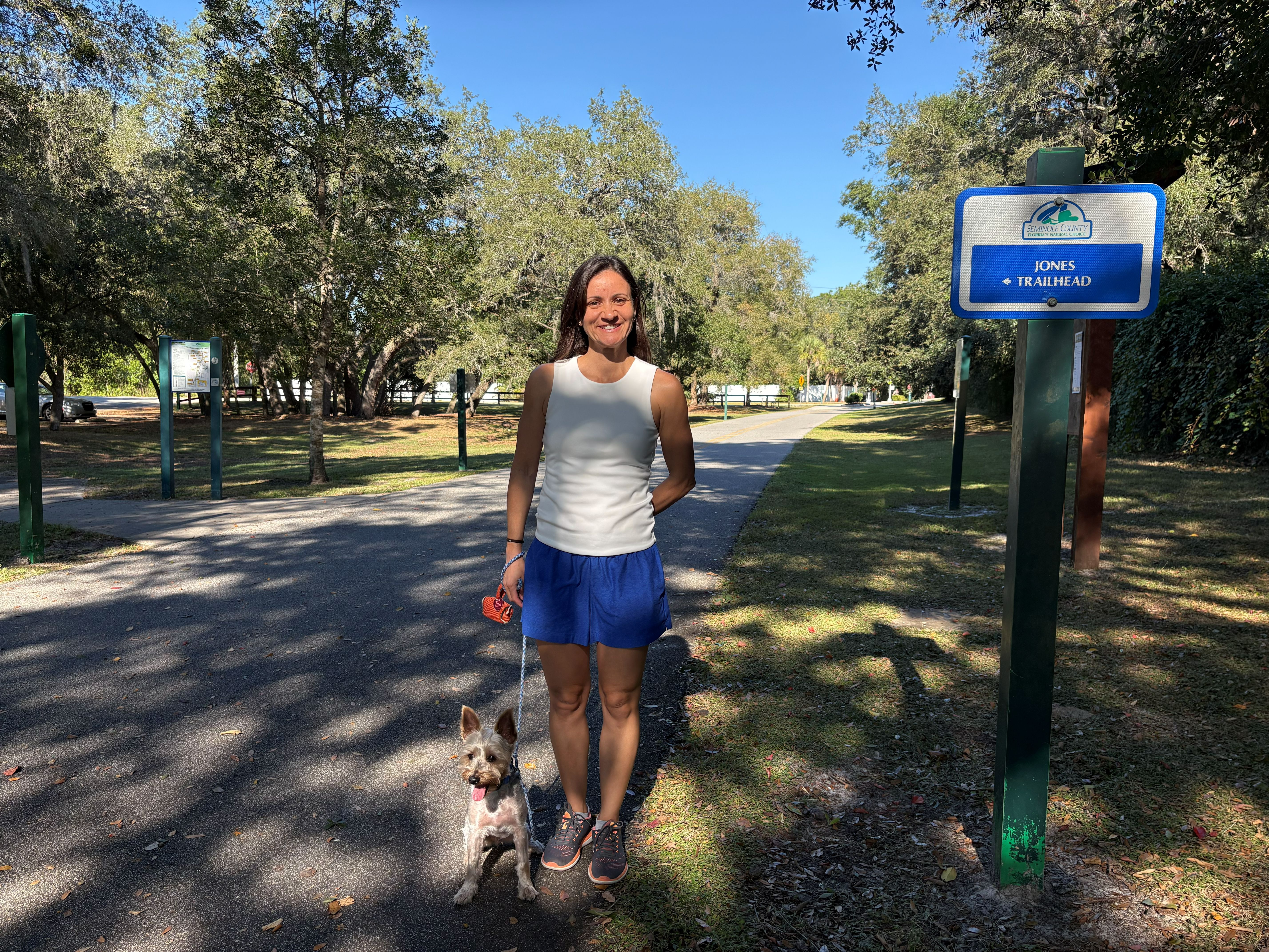 Happy dog being walked by professional walker in Lake Mary park